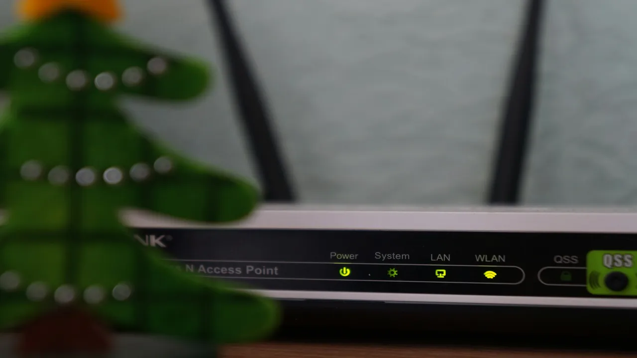 Close-up of diagnostic status lights on home networking hardware