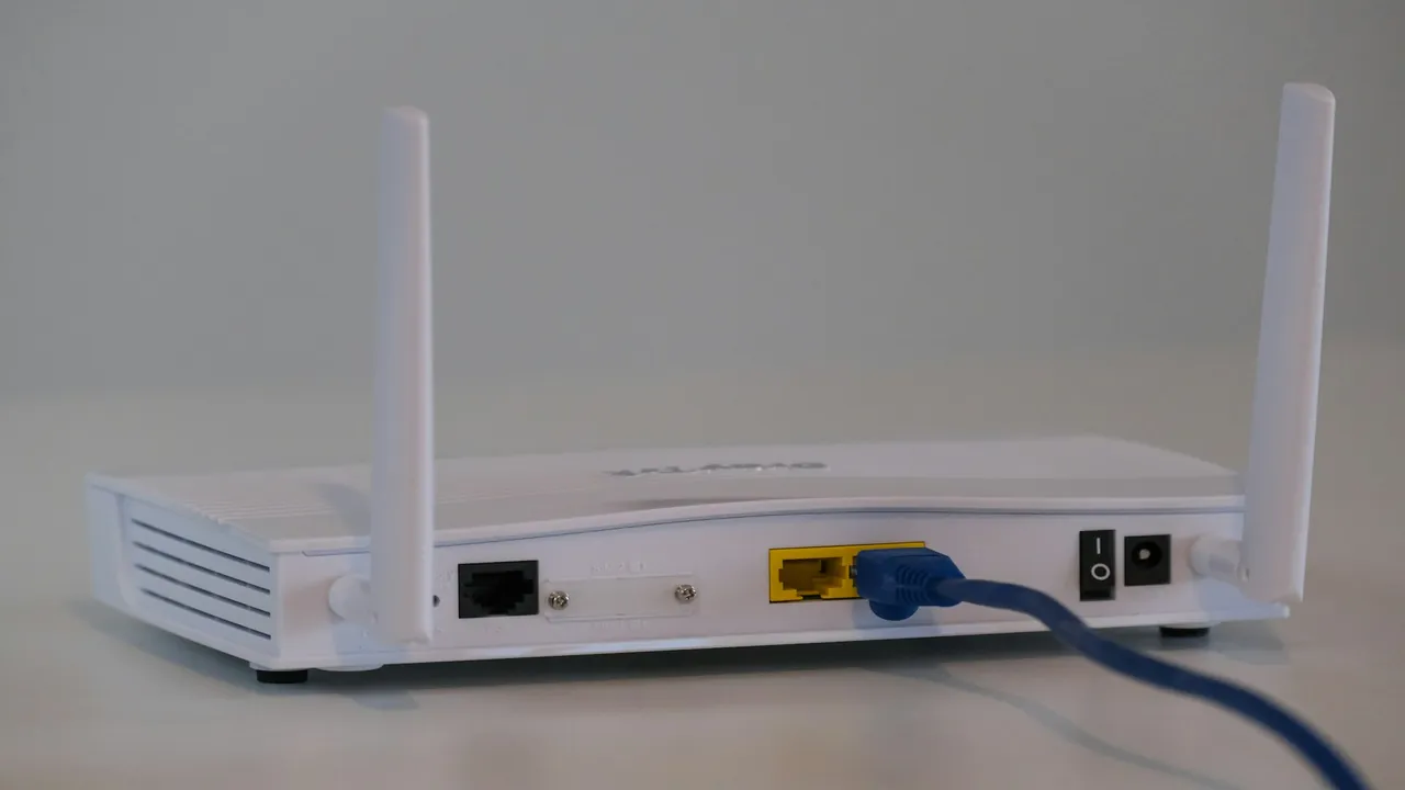 Close-up of a router and modem on a console during evening hours