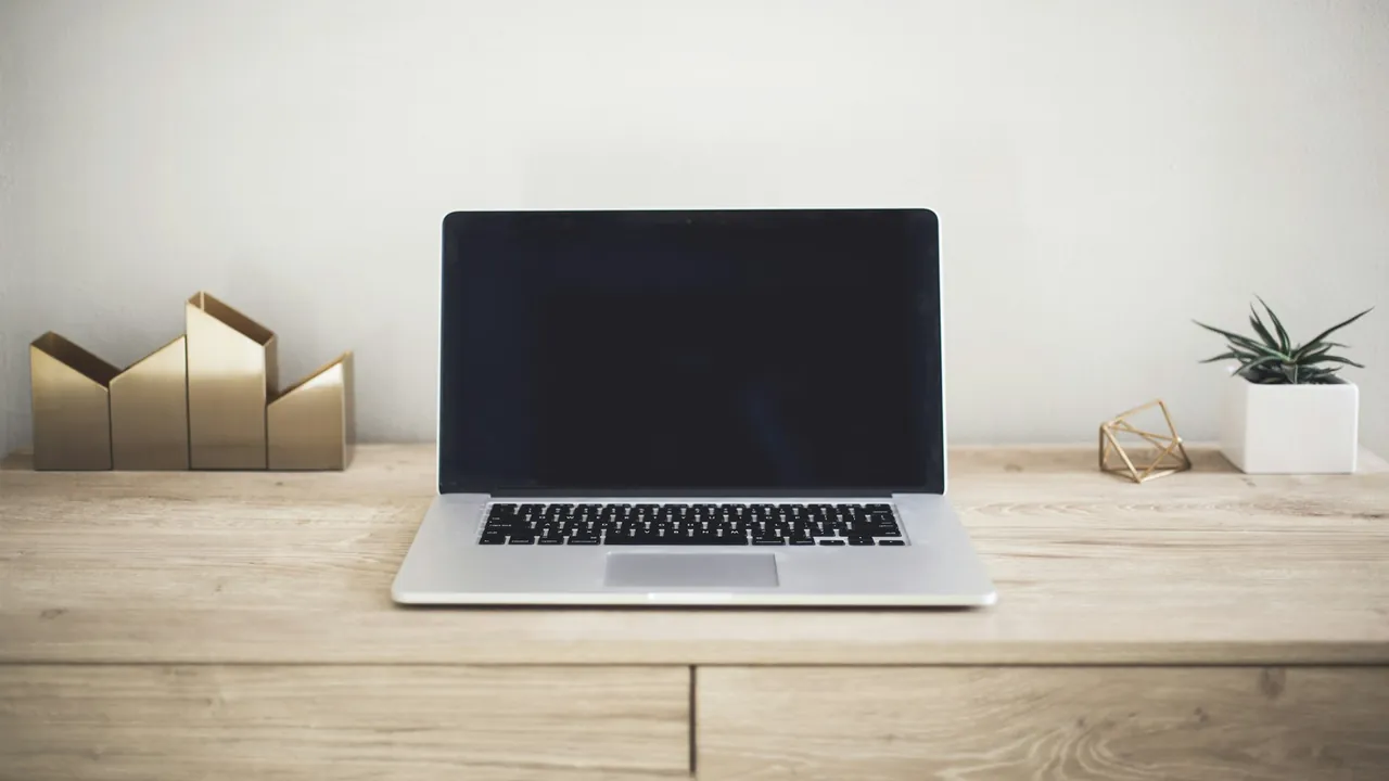 Laptop and router arranged on a desk representing network privacy