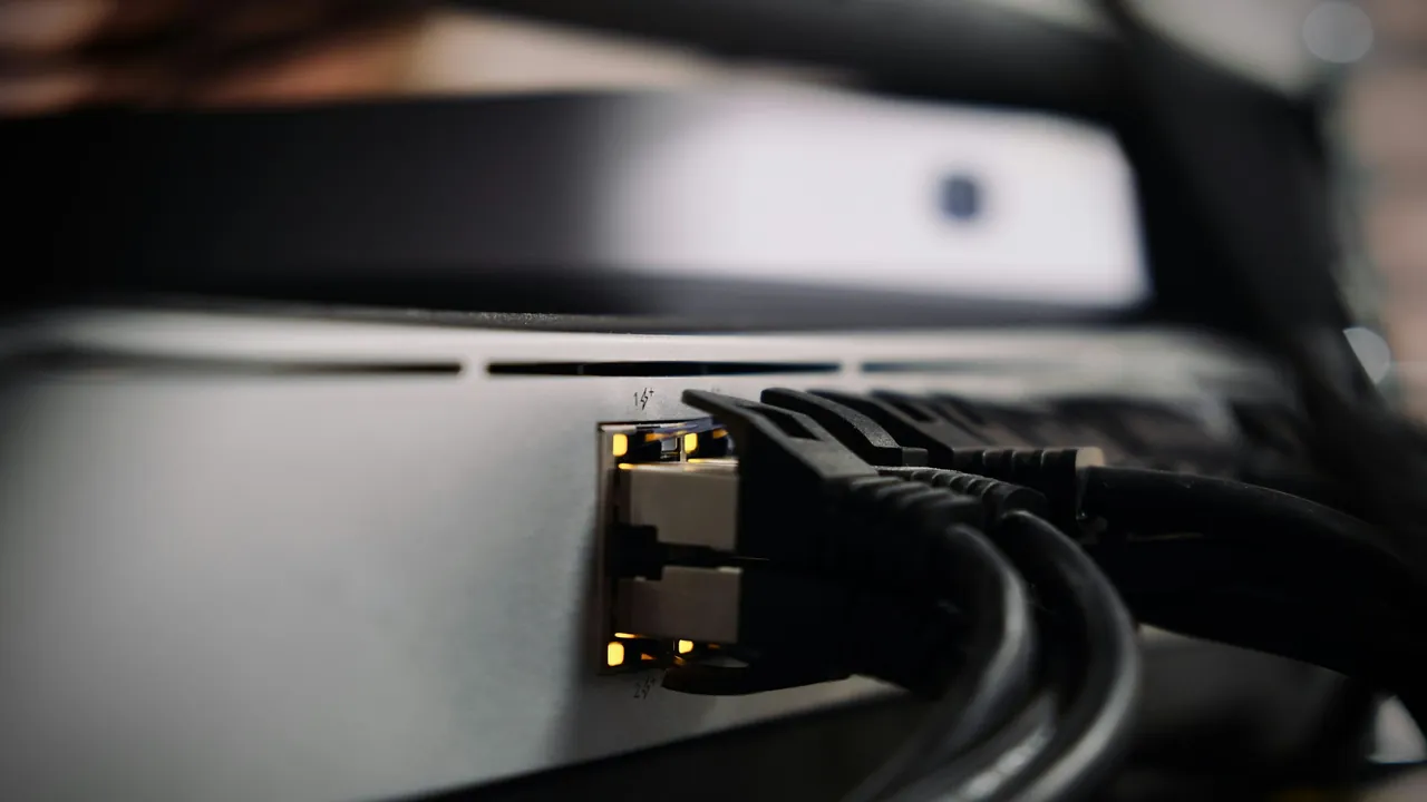 Rear panel view of a set-top box showing power, HDMI, and network connections